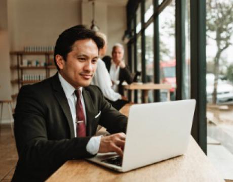 business owner using a laptop to setup an account